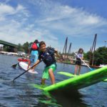 Summer Camp kids paddle boarding on the Willamette River