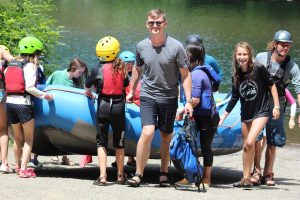 Summer camp kids at rafting boat ramp