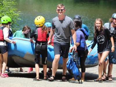 Summer camp kids at rafting boat ramp